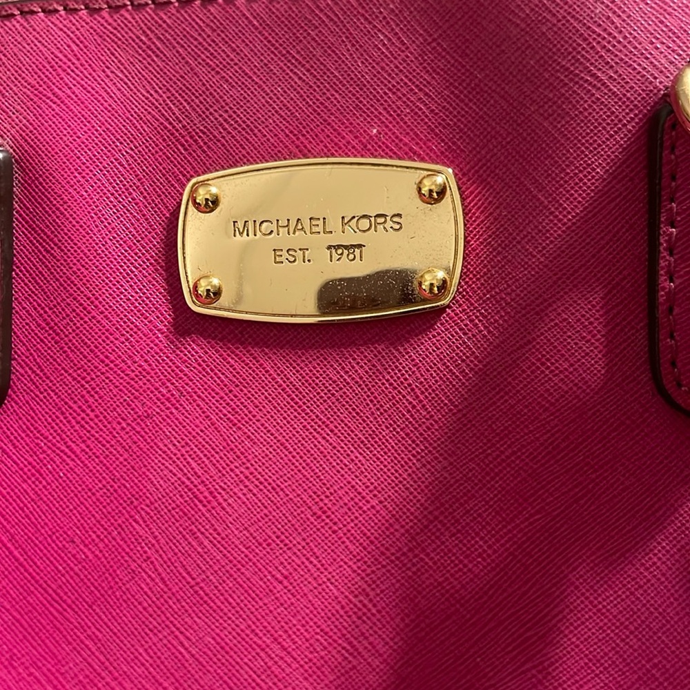 Michael Kors magenta handbag can also be used as a diaper bag summer carry on